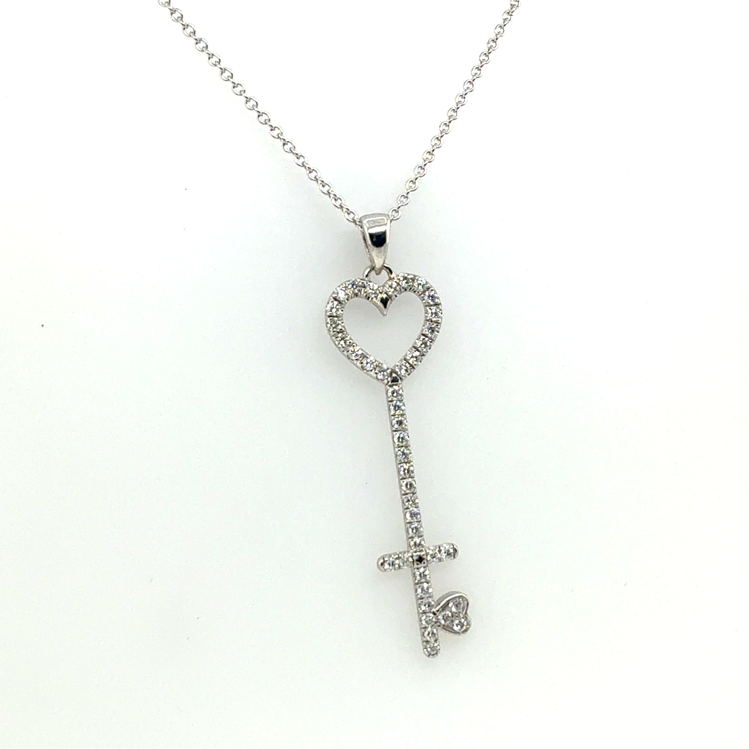 Modern White Gold 0.75 CARAT Natural Round Brilliant Diamond Key Shaped Pendant