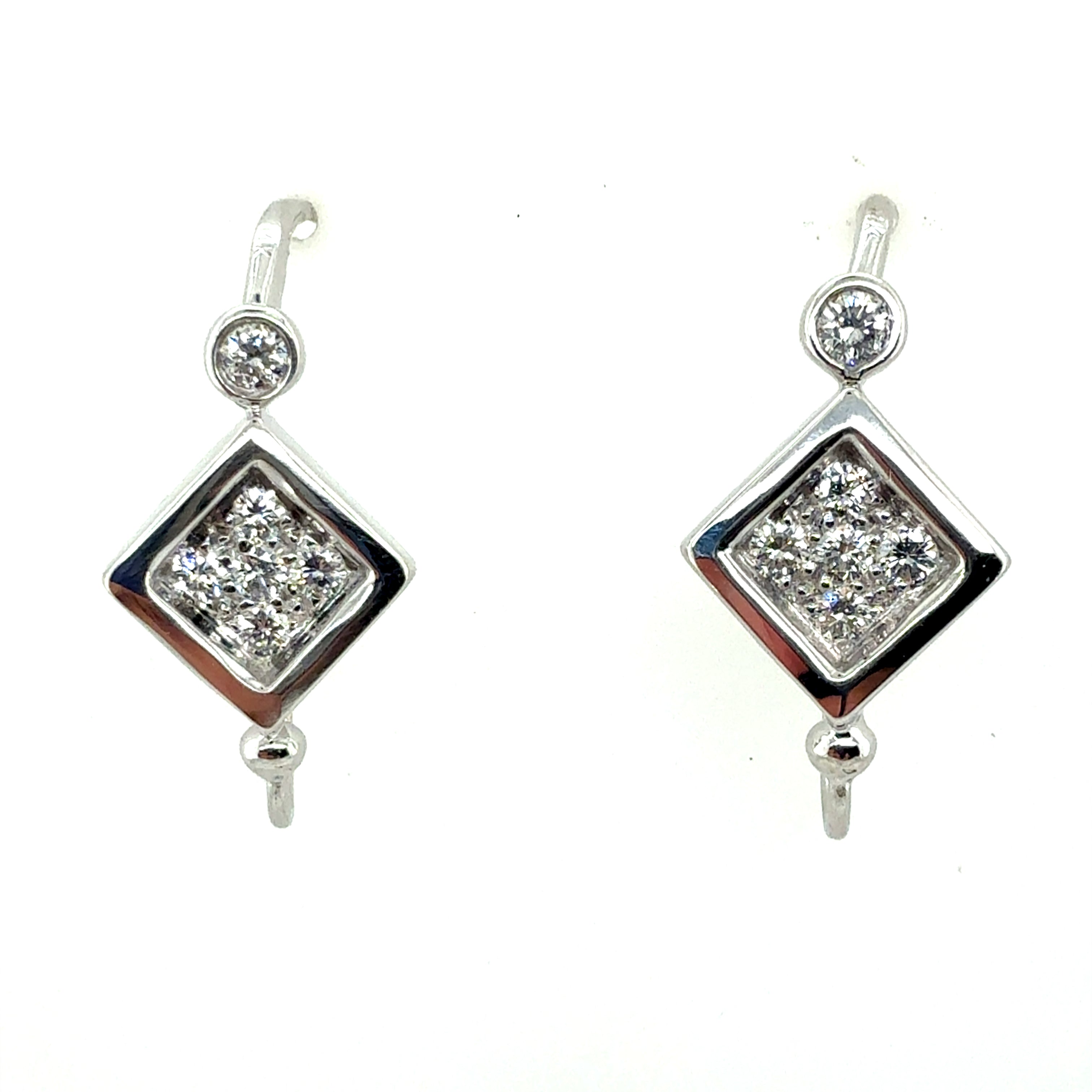 Retro White Gold 0.6 Carat Natural Colorless Diamond Earrings, Circa 1980