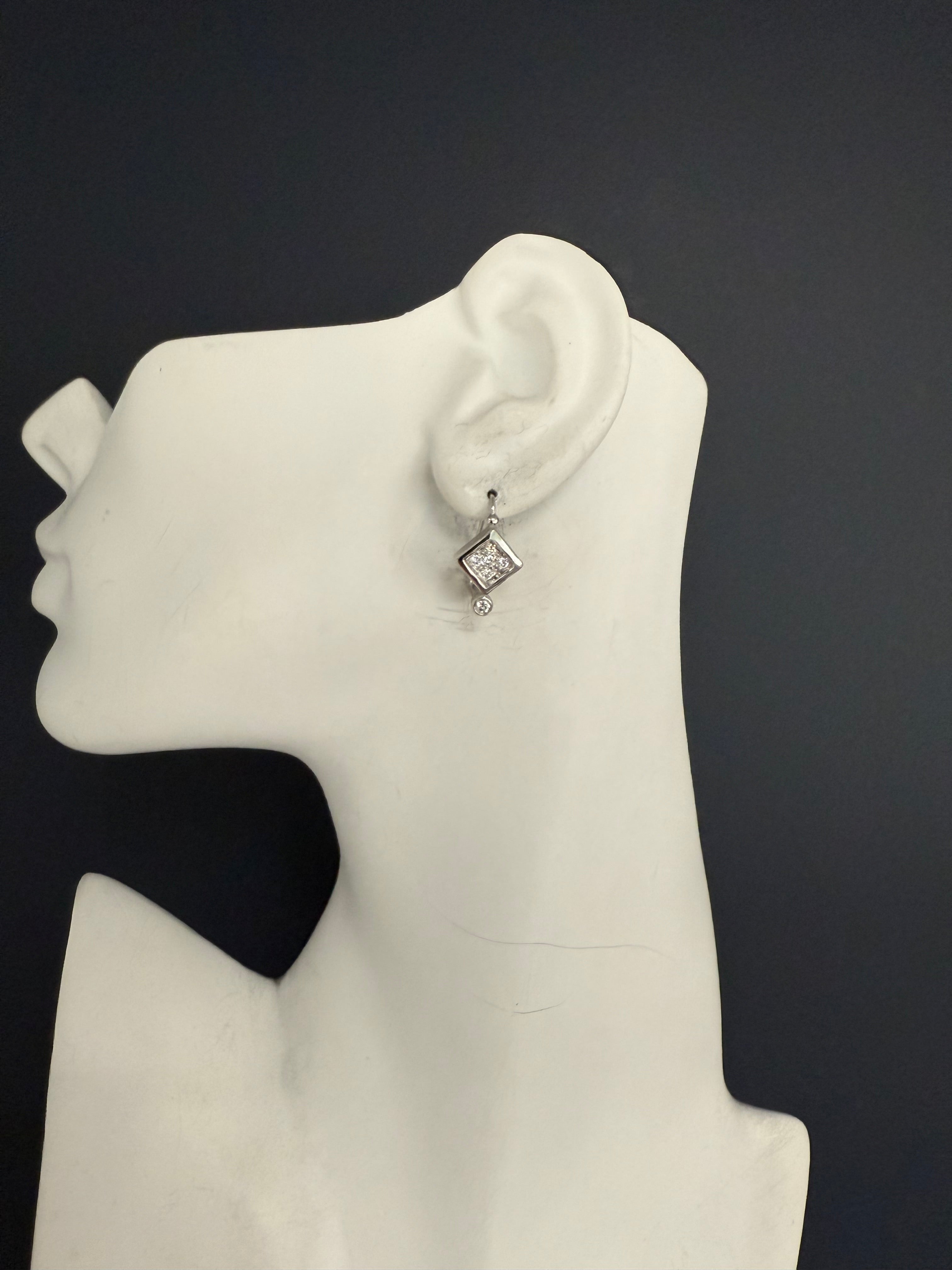 Retro White Gold 0.6 Carat Natural Colorless Diamond Earrings, Circa 1980