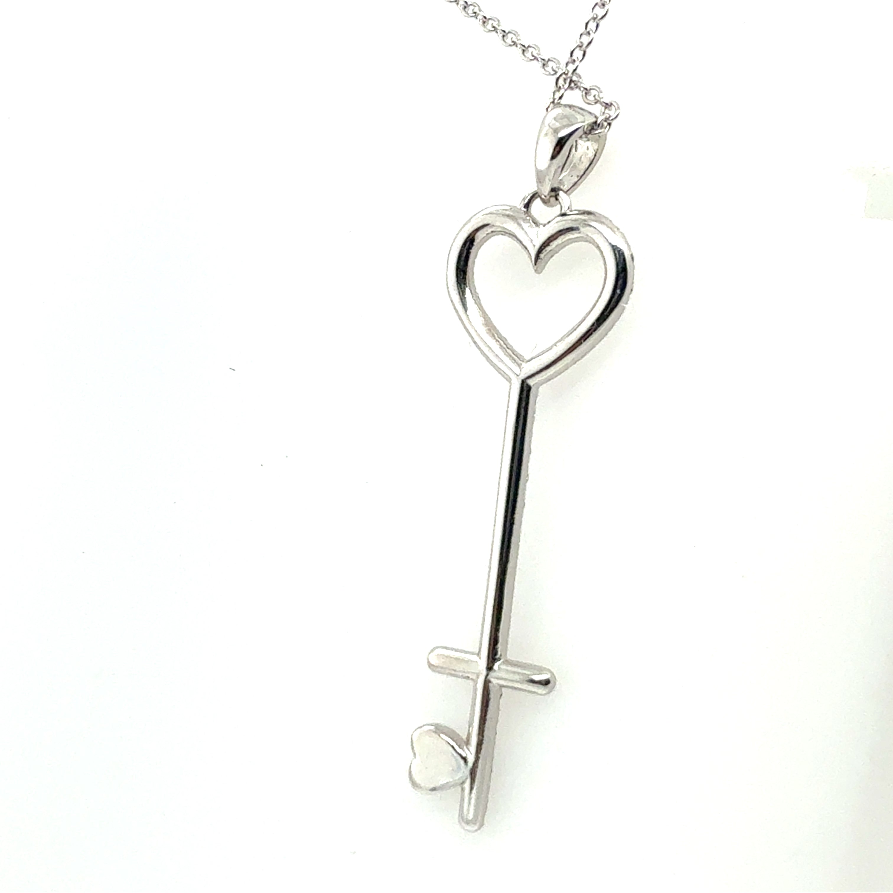 Modern White Gold 0.75 CARAT Natural Round Brilliant Diamond Key Shaped Pendant