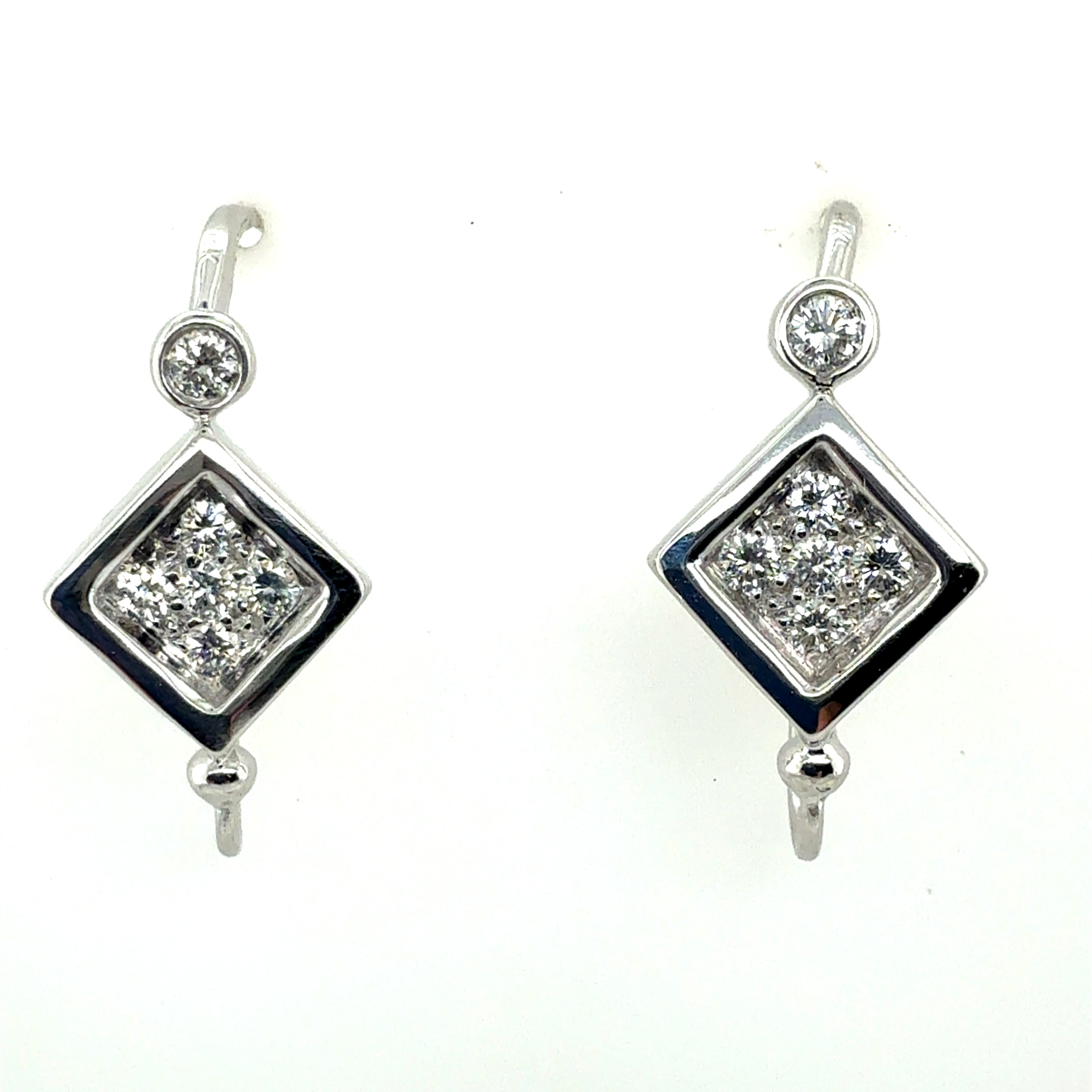 Retro White Gold 0.6 Carat Natural Colorless Diamond Earrings, Circa 1980
