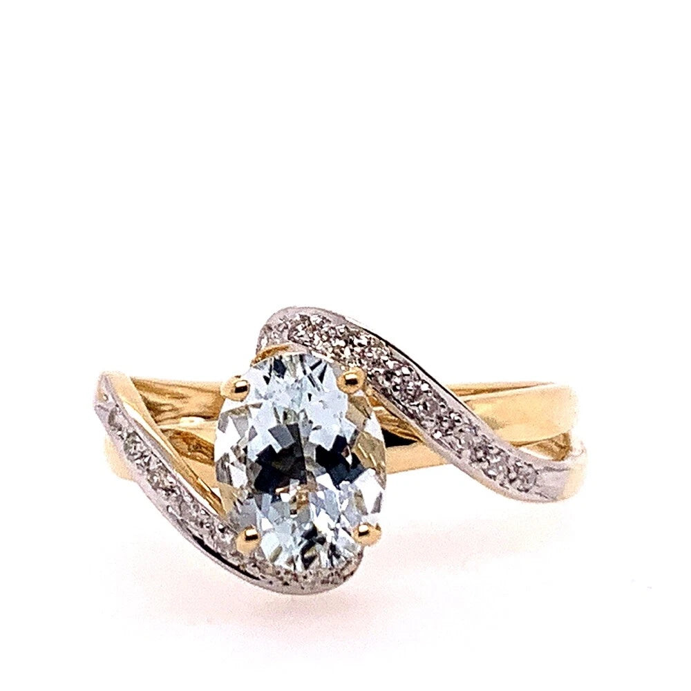 Modern Gold Natural .10 Carat Diamond and Oval Blue Aquamarine Cocktail Ring