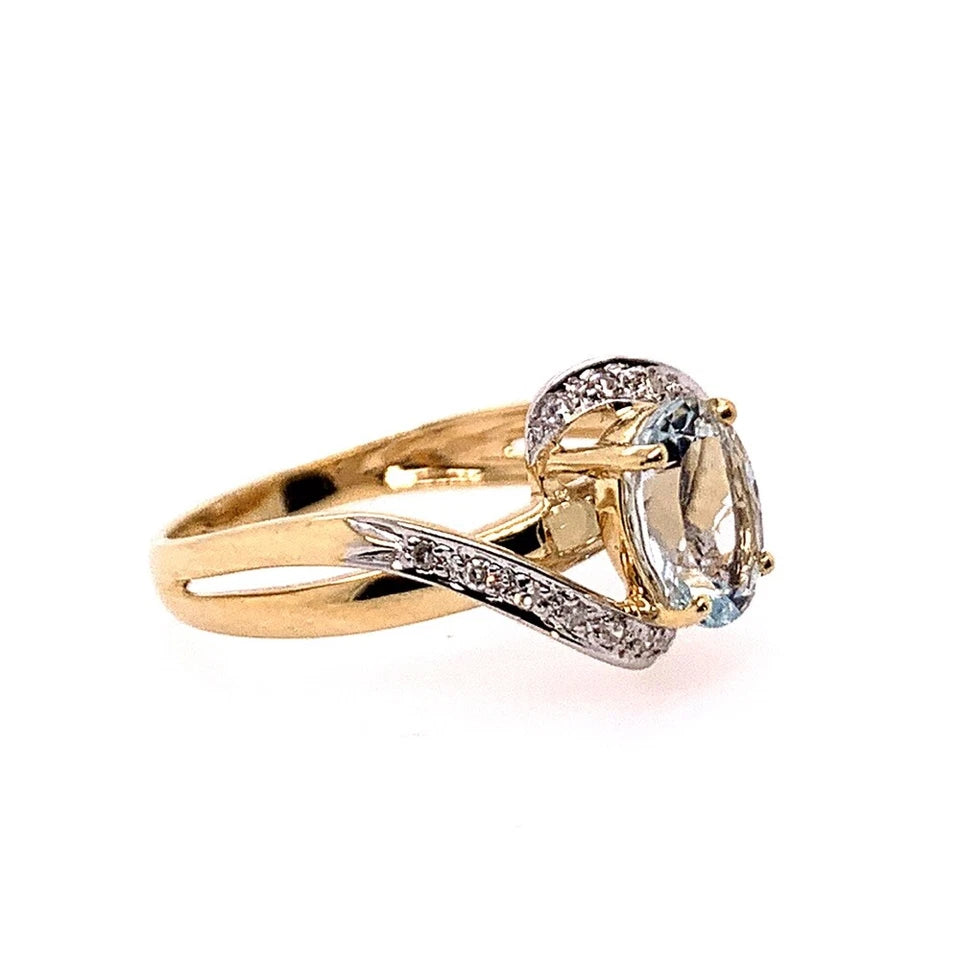 Modern Gold Natural .10 Carat Diamond and Oval Blue Aquamarine Cocktail Ring