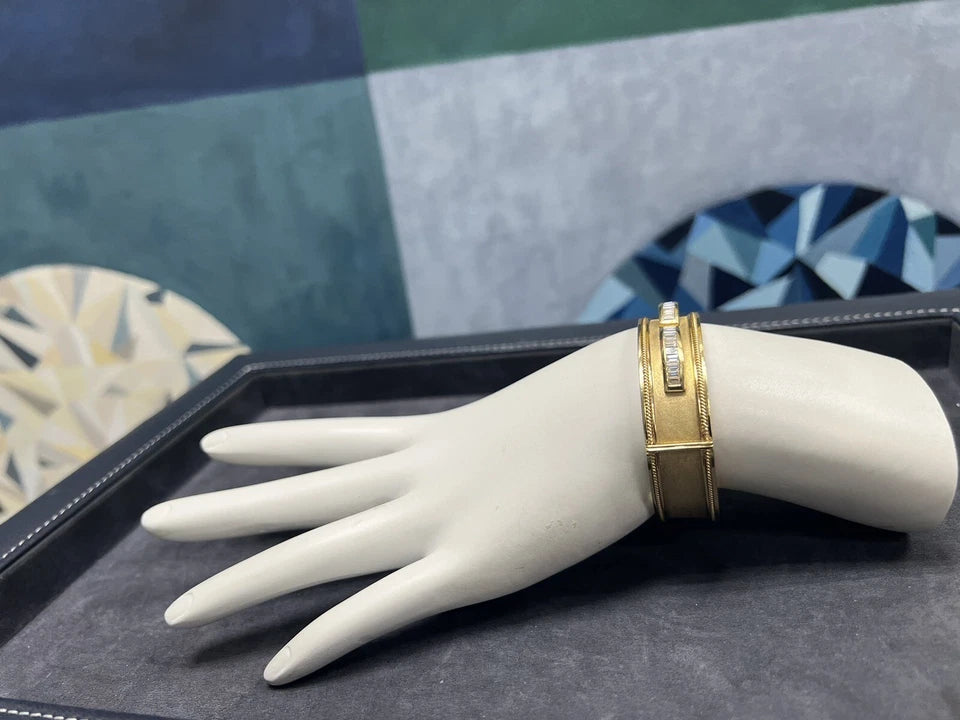 Retro Gold 2.50 Carat Natural Colorless Baguette Diamond Bangle Circa 1970