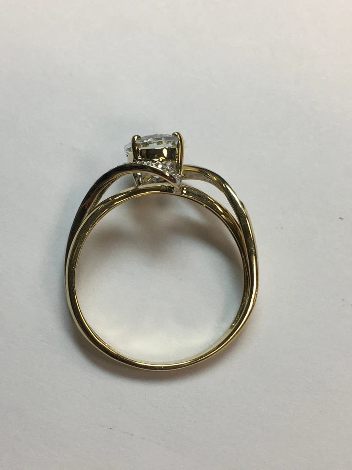 Modern Gold Natural .10 Carat Diamond and Oval Blue Aquamarine Cocktail Ring