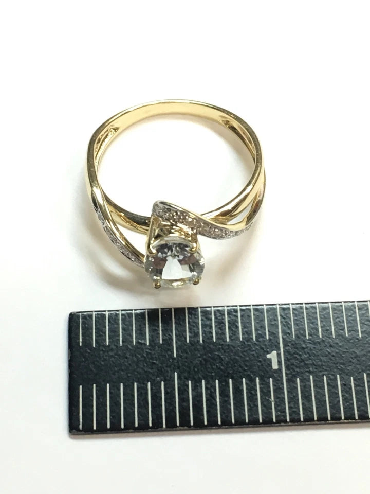 Modern Gold Natural .10 Carat Diamond and Oval Blue Aquamarine Cocktail Ring
