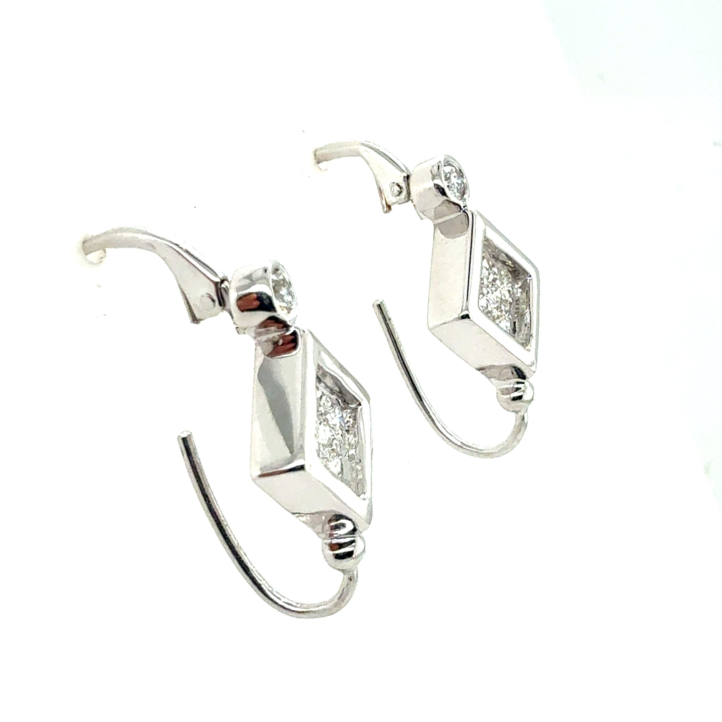 Retro White Gold 0.6 Carat Natural Colorless Diamond Earrings, Circa 1980