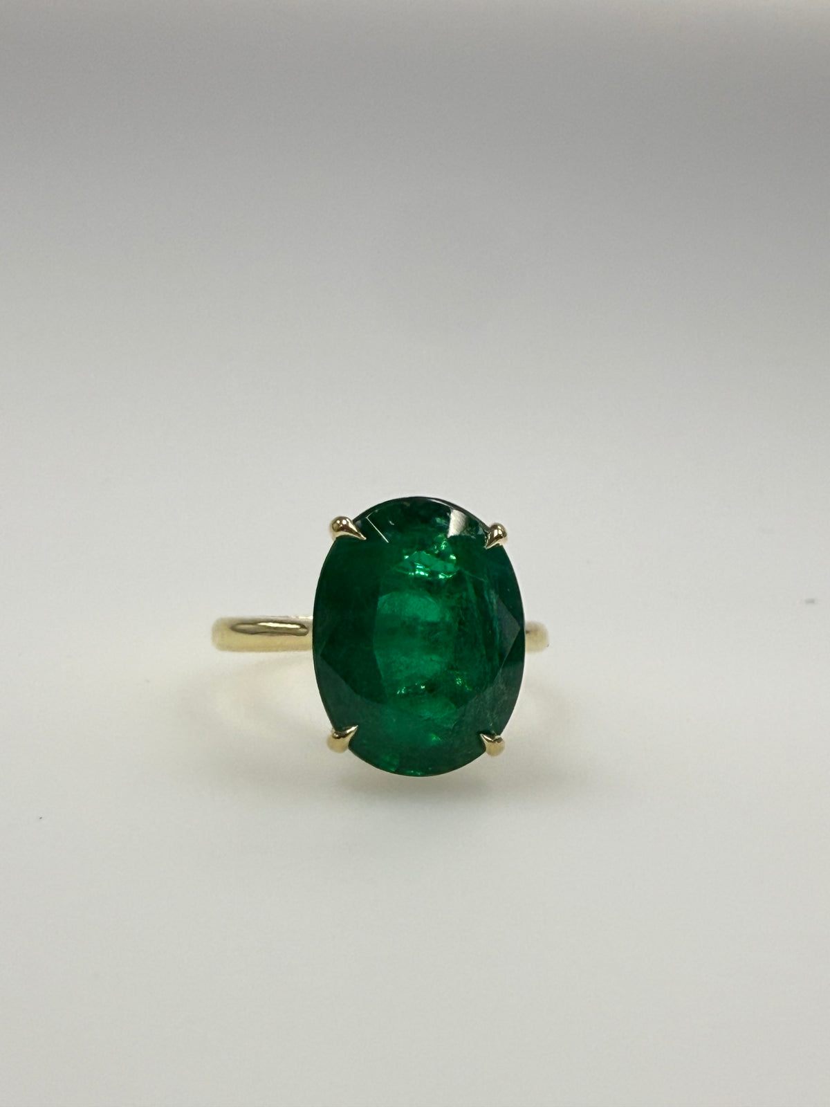 Modern Gold GIA Certified 6.53 Carat Natural Oval Zambian Green Emerald Ring