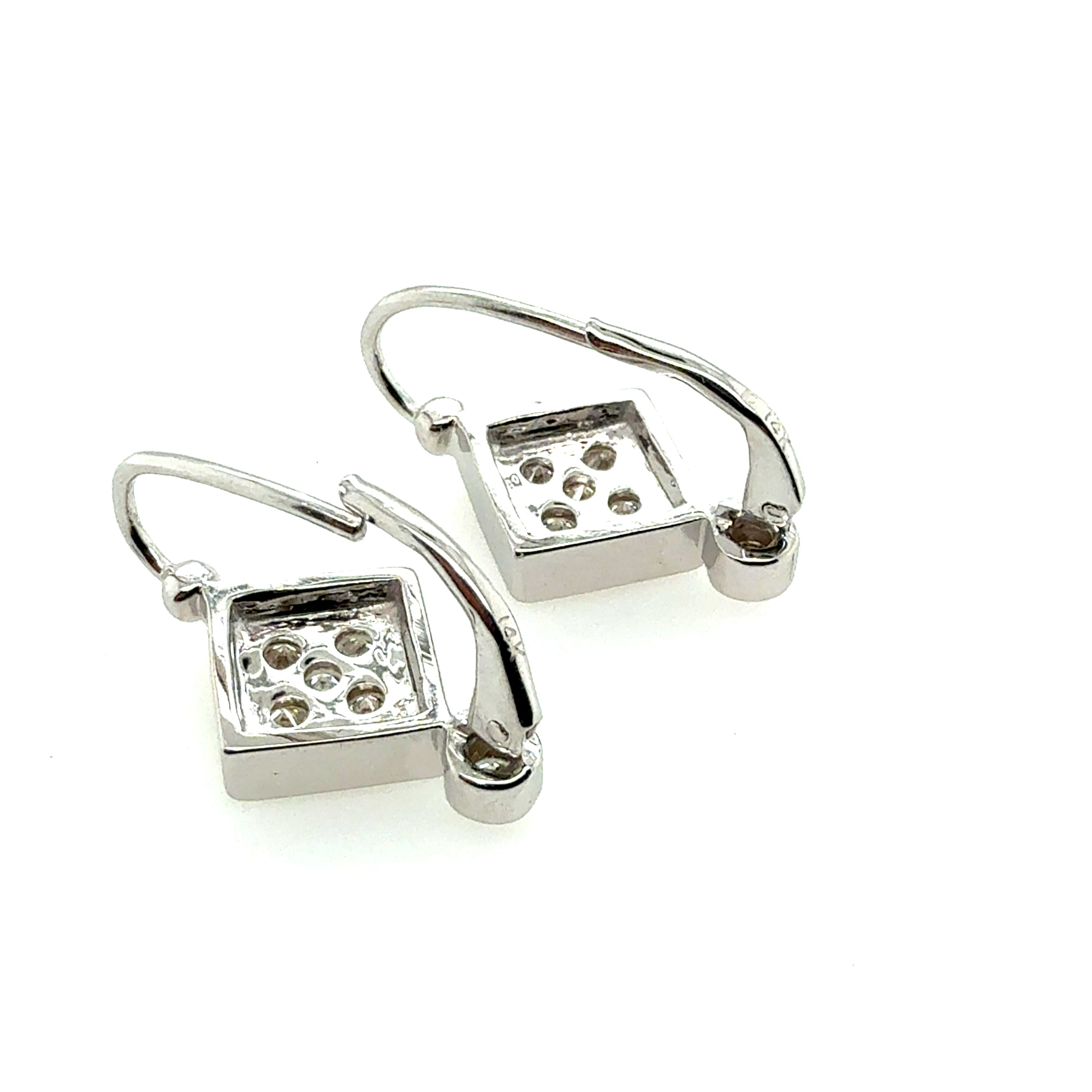 Retro White Gold 0.6 Carat Natural Colorless Diamond Earrings, Circa 1980